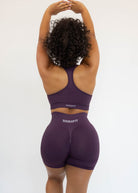 Person wearing a purple athletic outfit with 'Bikewear' branding on a white background